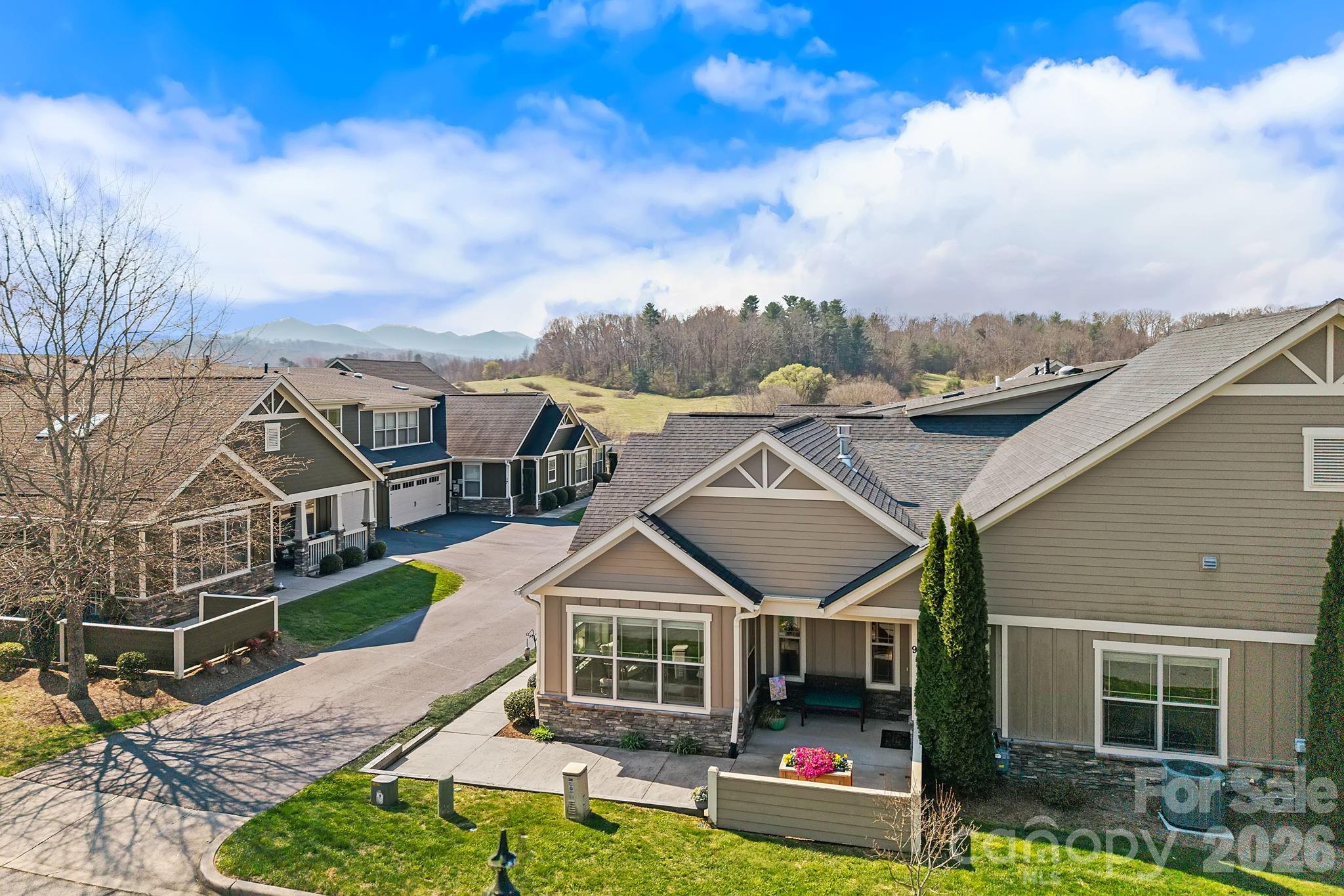 9 Brookstone Place Candler, NC 28715 - Photo 27 of 36 a front view of a house with garden