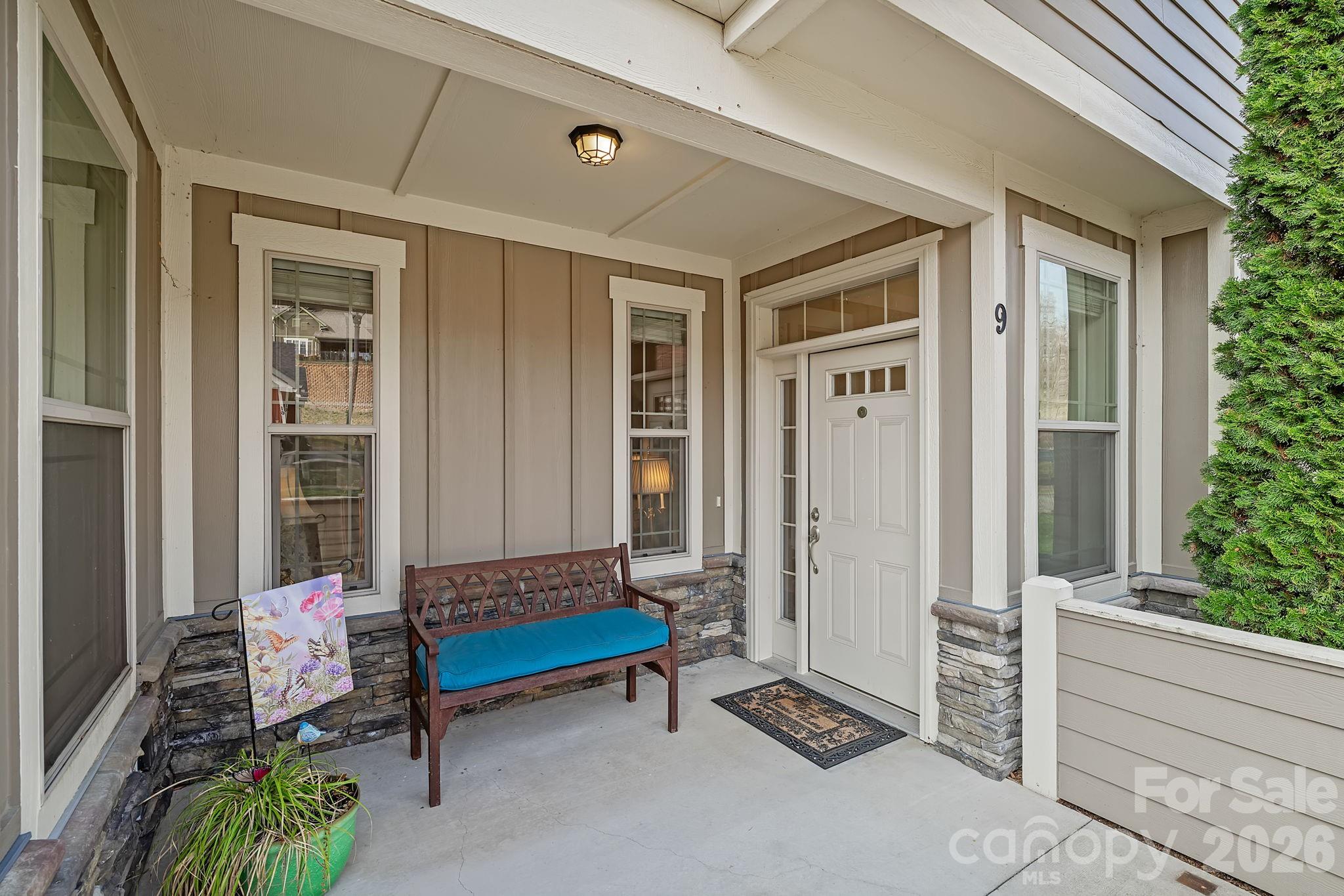 9 Brookstone Place Candler, NC 28715 - Photo 3 of 36 a building outdoor space with patio furniture