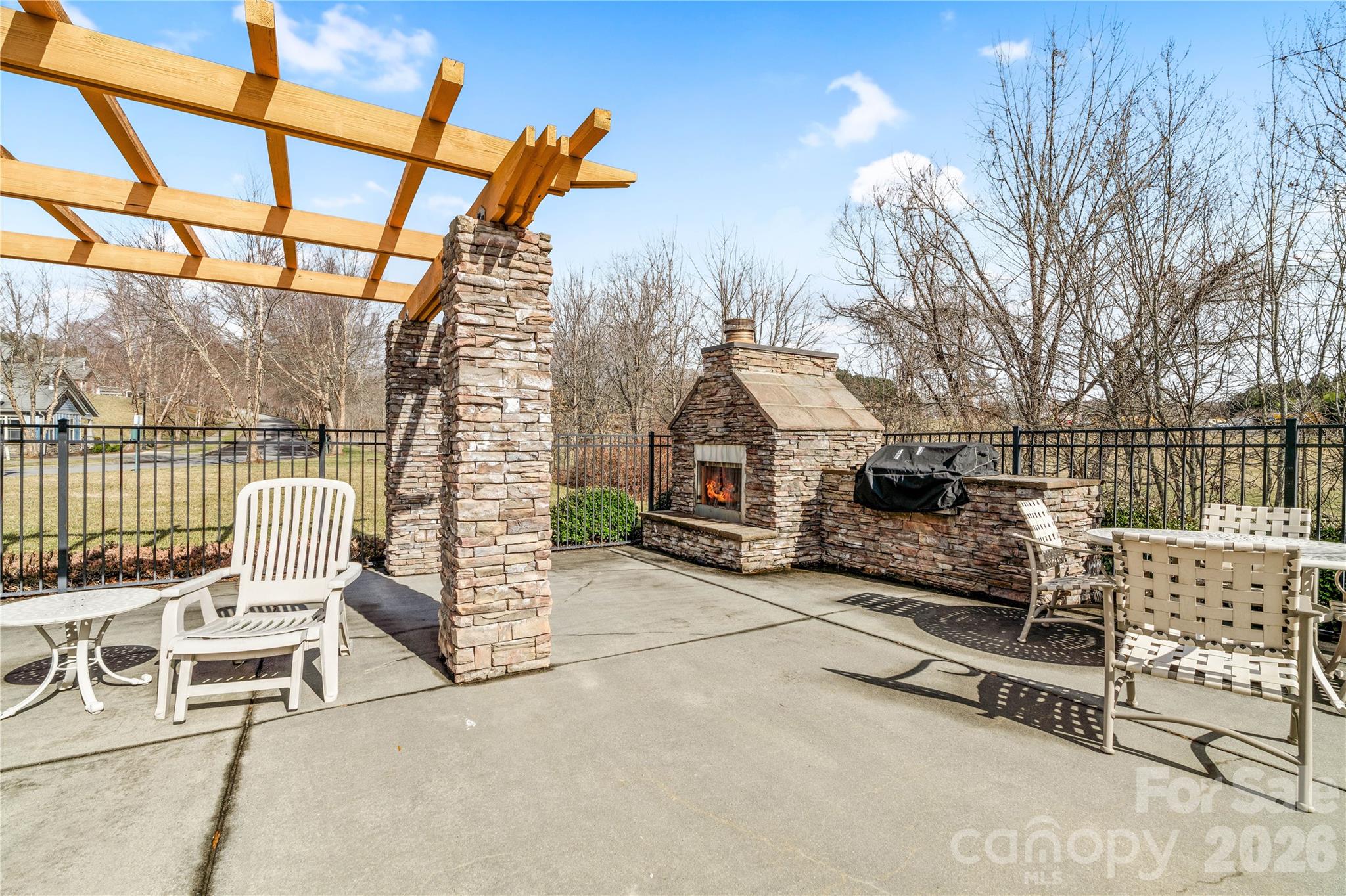 9 Brookstone Place Candler, NC 28715 - Photo 34 of 36 a roof deck with a barbeque and wooden stairs