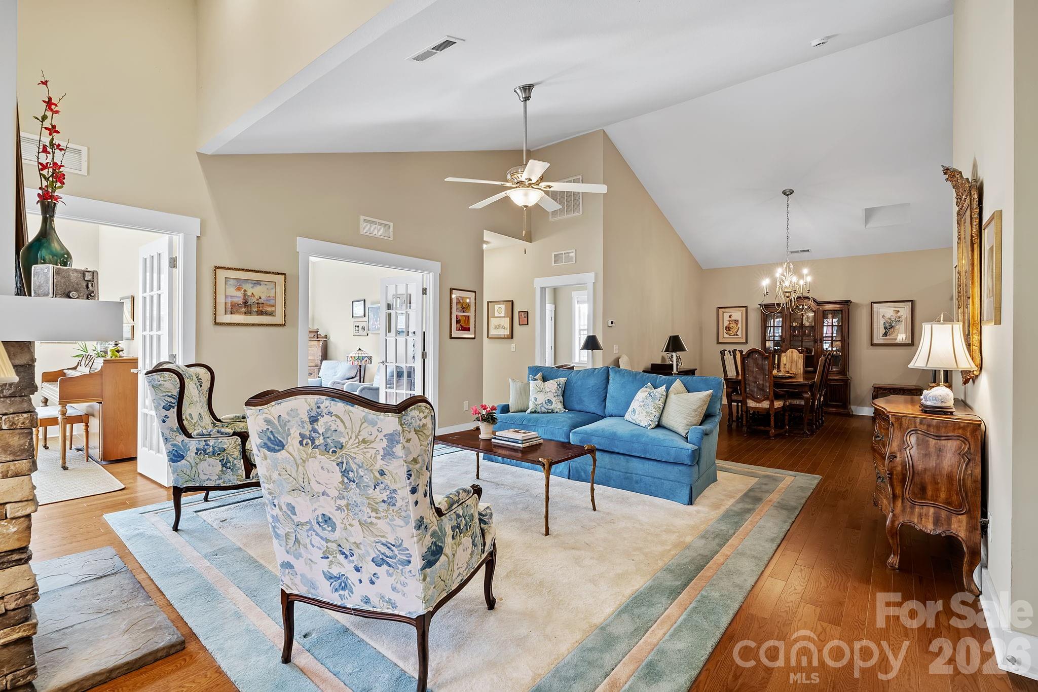 9 Brookstone Place Candler, NC 28715 - Photo 4 of 36 a living room with furniture a chandelier and a table