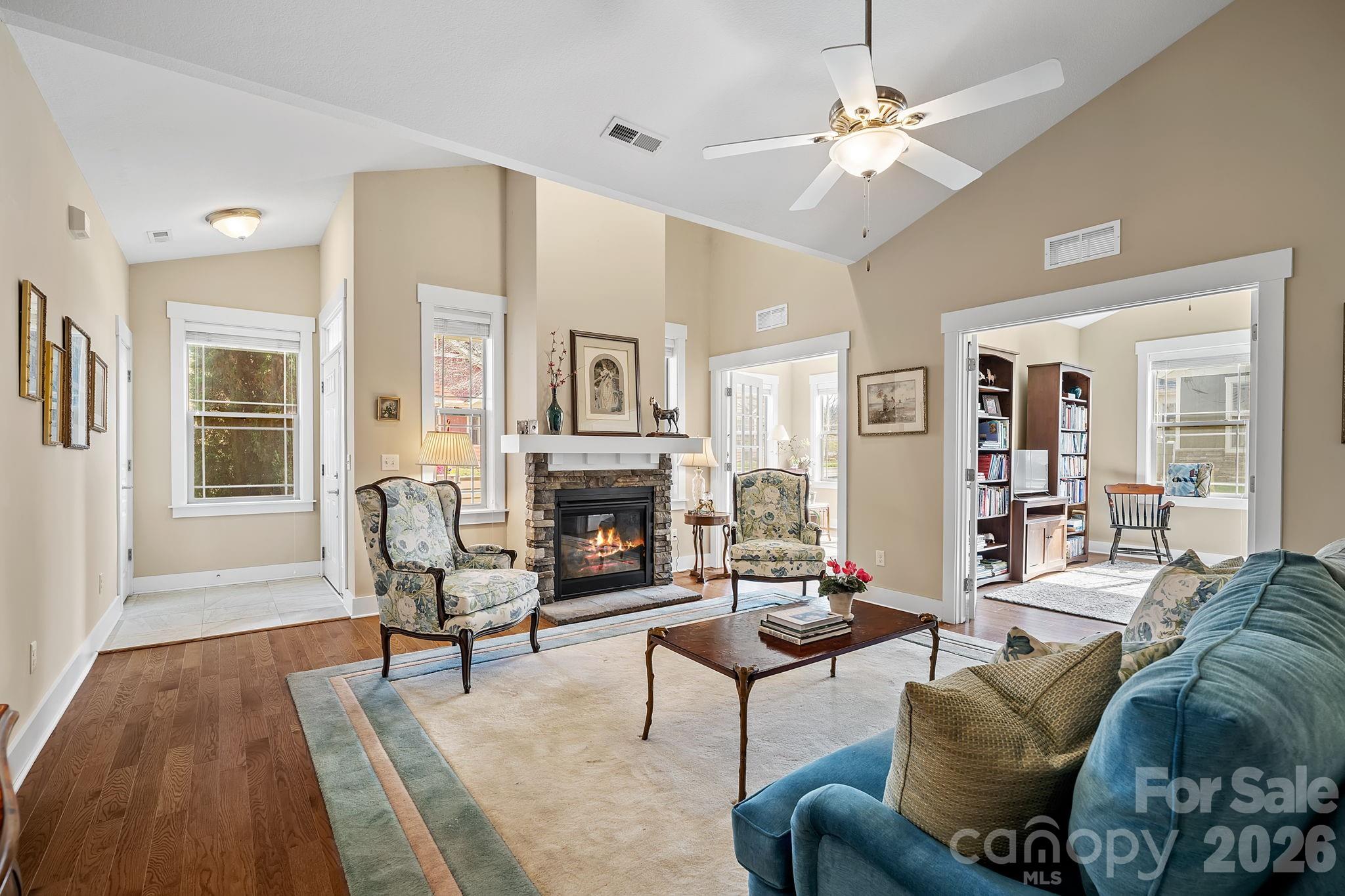 9 Brookstone Place Candler, NC 28715 - Photo 5 of 36 a living room with furniture a fireplace and a table