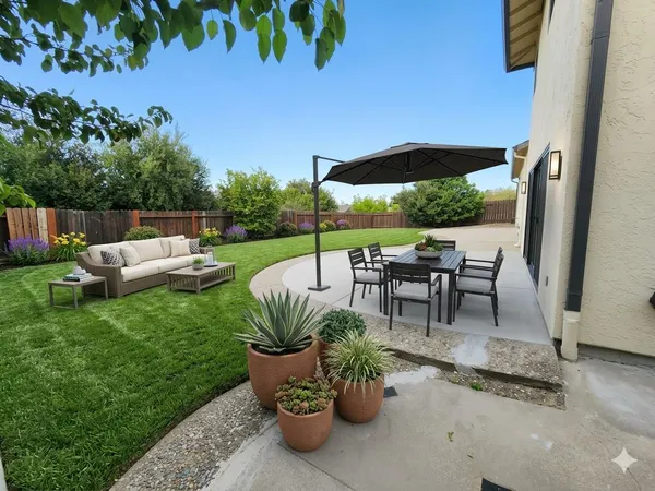 a view of a chairs and table in the patio