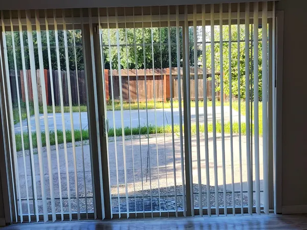 a view of a garden from a balcony