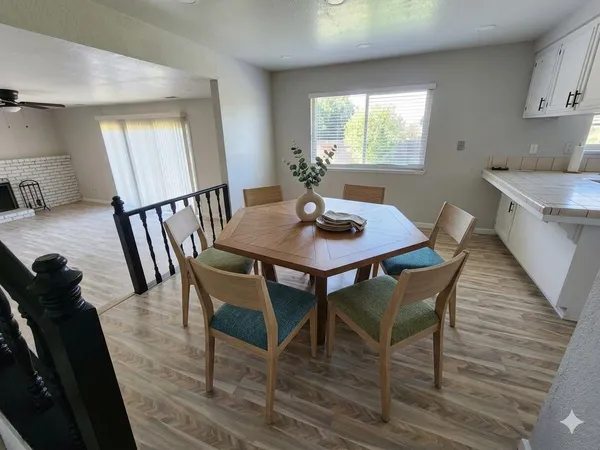 a view of a dining room with furniture and window
