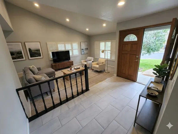a living room with furniture and a flat screen tv