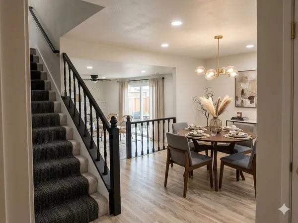 a view of a dining room with furniture and wooden floor