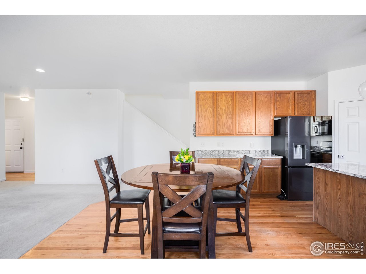 5861 Mountain Shadows Boulevard Firestone, CO 80504 - Photo 14 of 39 a dining room with furniture and window