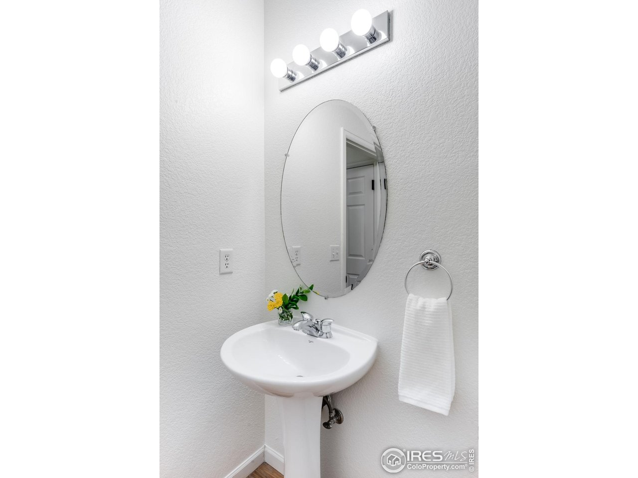 5861 Mountain Shadows Boulevard Firestone, CO 80504 - Photo 17 of 39 a bathroom with a sink and a mirror