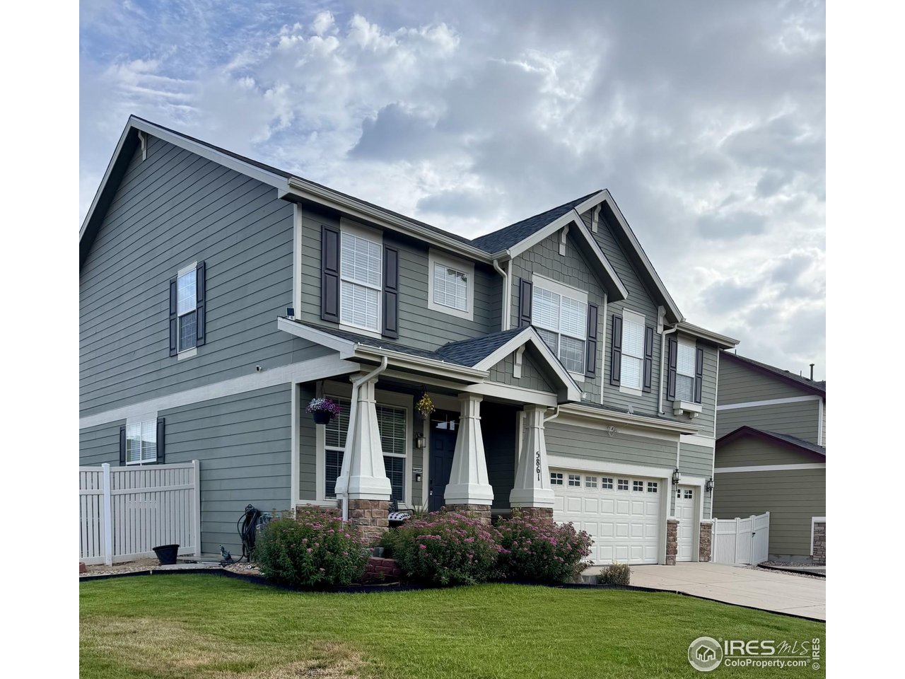 5861 Mountain Shadows Boulevard Firestone, CO 80504 - Photo 2 of 39 a front view of a house with a yard