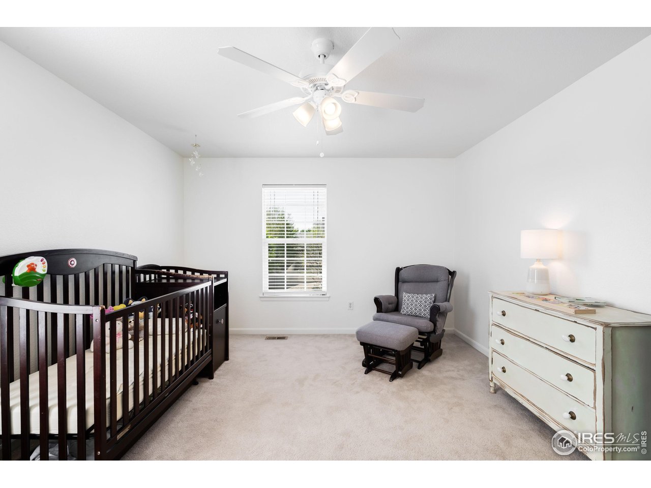5861 Mountain Shadows Boulevard Firestone, CO 80504 - Photo 28 of 39 a living room with furniture and a window