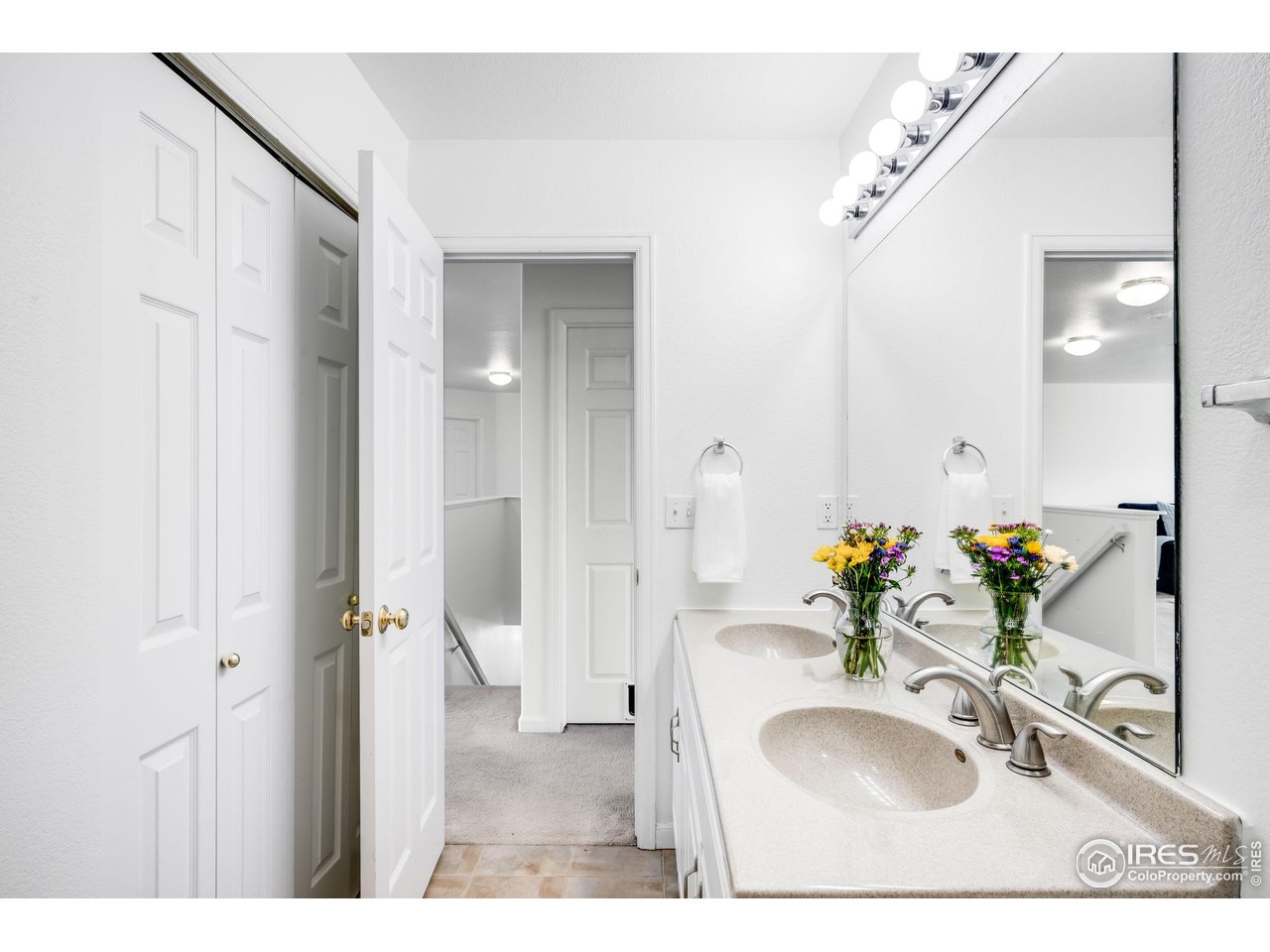 5861 Mountain Shadows Boulevard Firestone, CO 80504 - Photo 29 of 39 a bathroom with a sink and a mirror