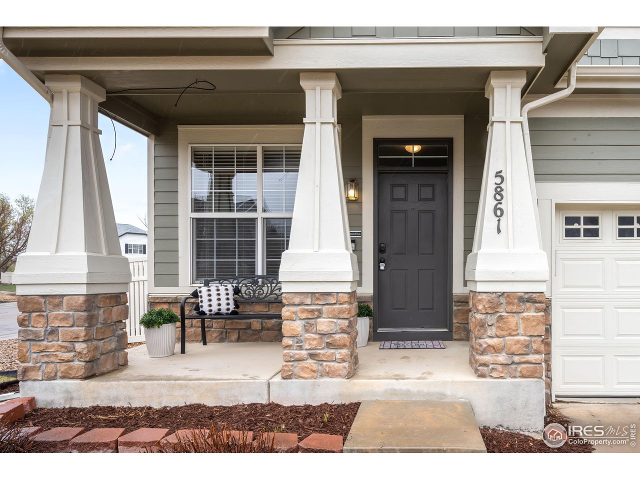 5861 Mountain Shadows Boulevard Firestone, CO 80504 - Photo 3 of 39 a front view of a house with large windows