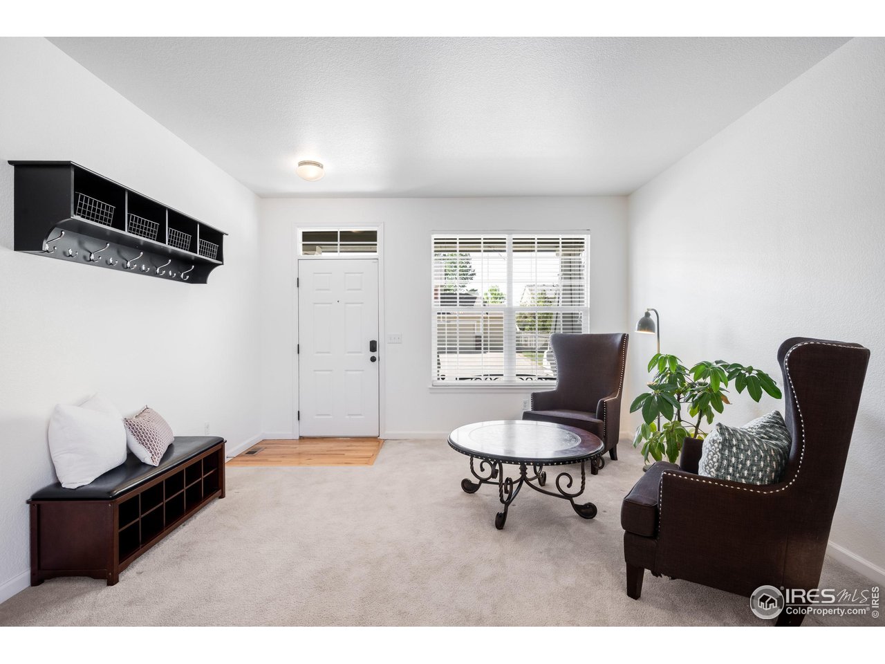 5861 Mountain Shadows Boulevard Firestone, CO 80504 - Photo 36 of 39 a living room with furniture and a window