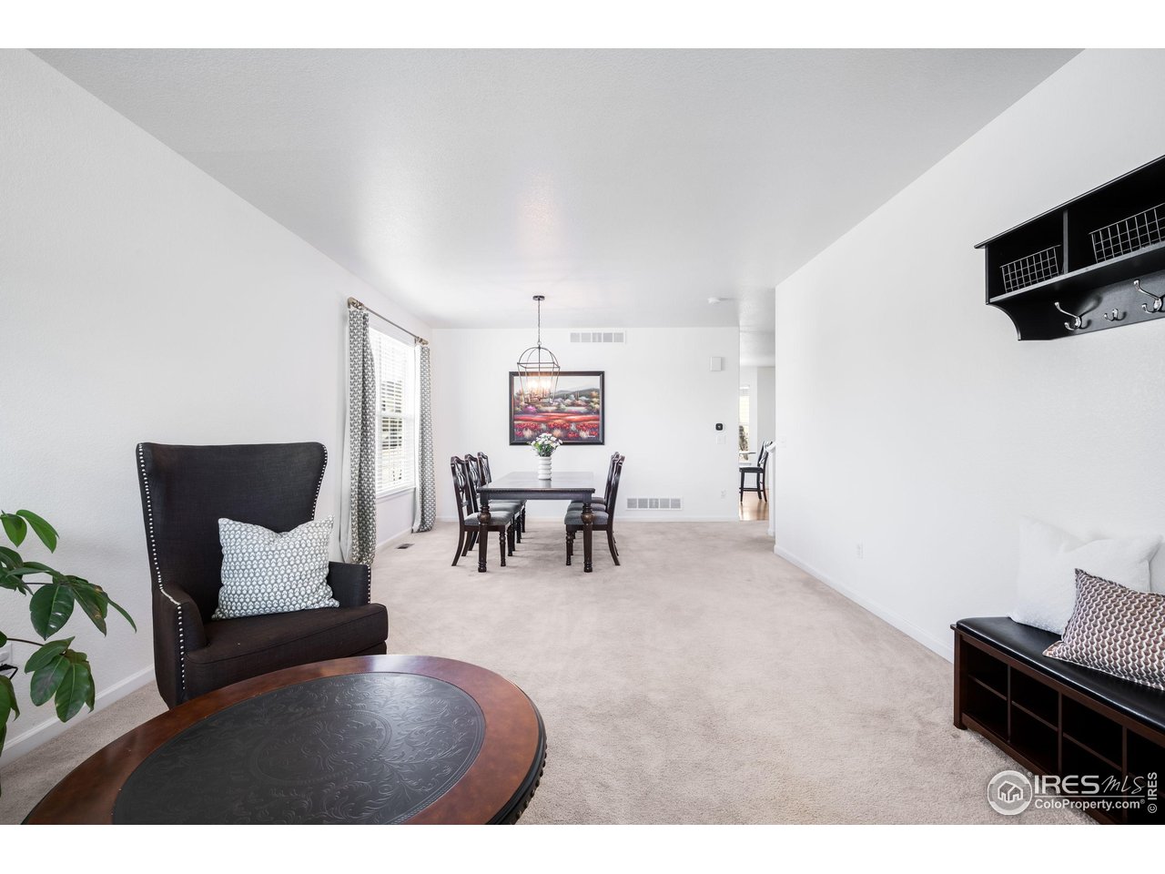 5861 Mountain Shadows Boulevard Firestone, CO 80504 - Photo 37 of 39 a living room with furniture and a flat screen tv