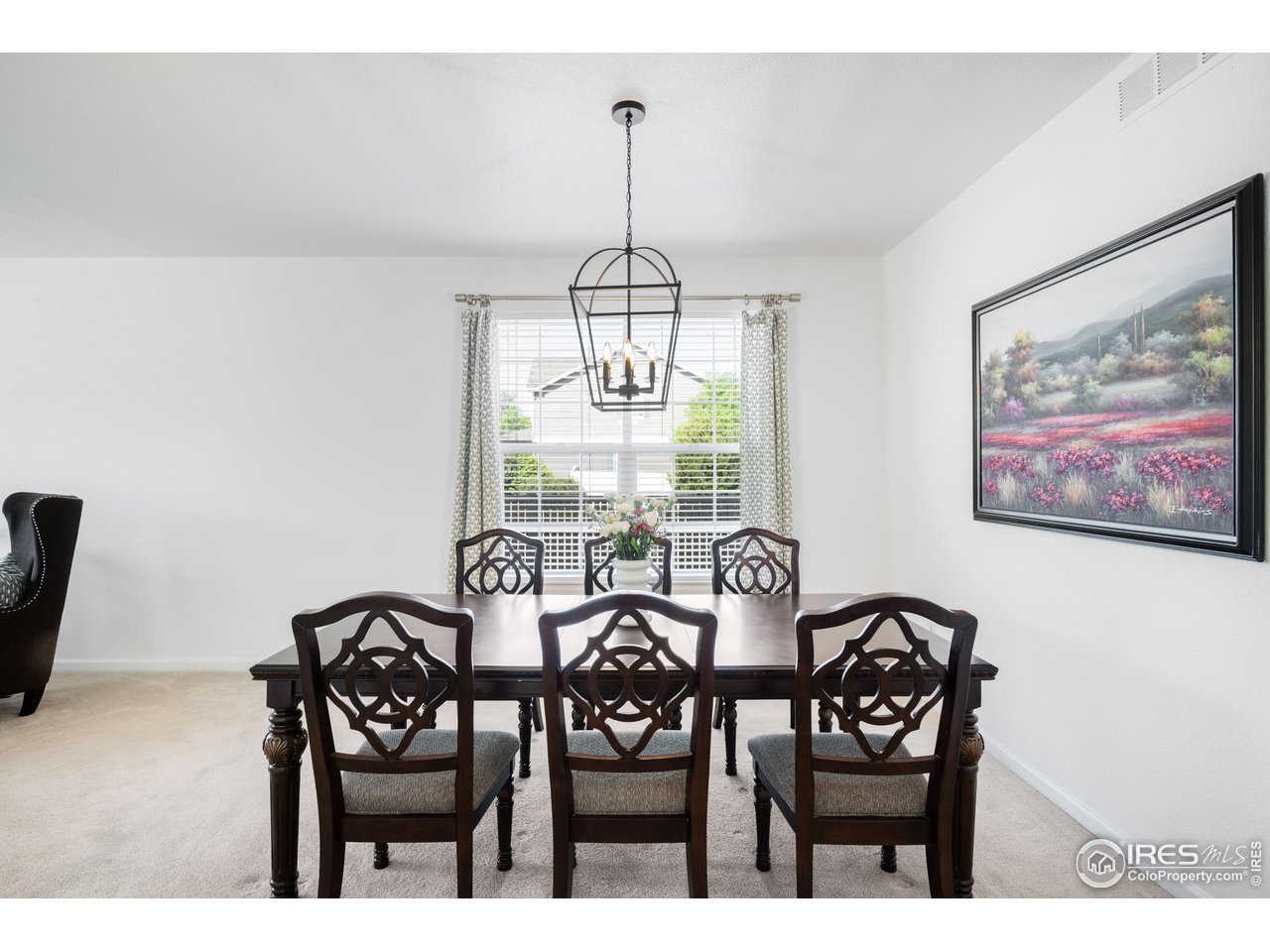 5861 Mountain Shadows Boulevard Firestone, CO 80504 - Photo 6 of 39 a view of a dining room with furniture window and outside view