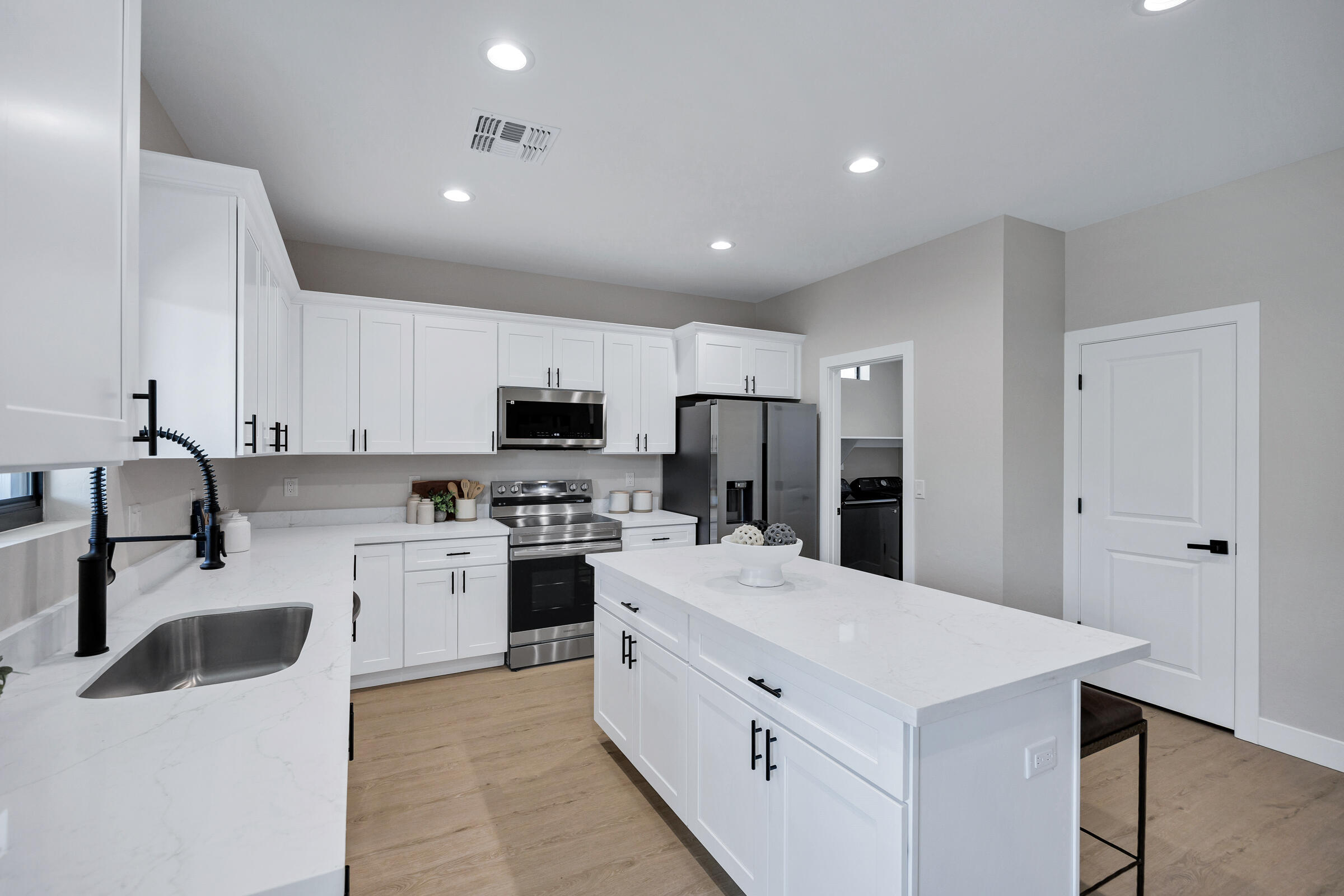 1105 East Frontier Street Payson, AZ 85541 - Photo 12 of 26 a kitchen with white cabinets and stainless steel appliances