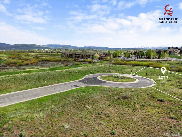 a view of a lake with a yard