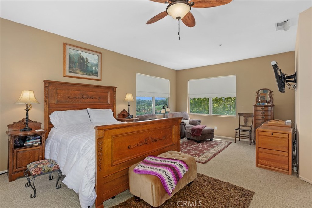 1957 Cresthaven Drive Vista, CA 92084 - Photo 18 of 47 a bedroom with a bed and ceiling fan