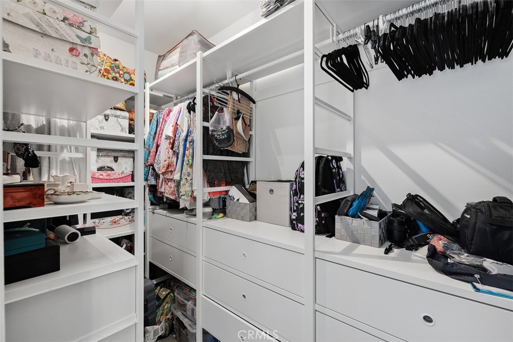 1957 Cresthaven Drive Vista, CA 92084 - Photo 22 of 47 a view of walk in closet with clothes and shoes
