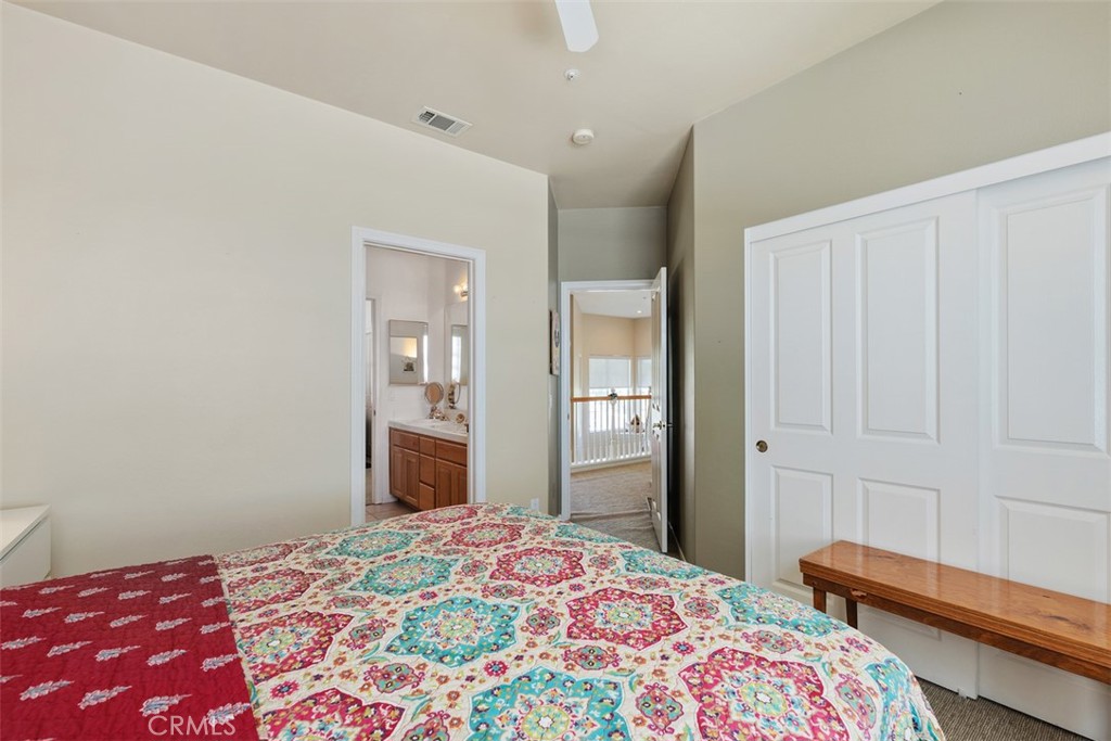1957 Cresthaven Drive Vista, CA 92084 - Photo 24 of 47 a bedroom with a bed and a dresser