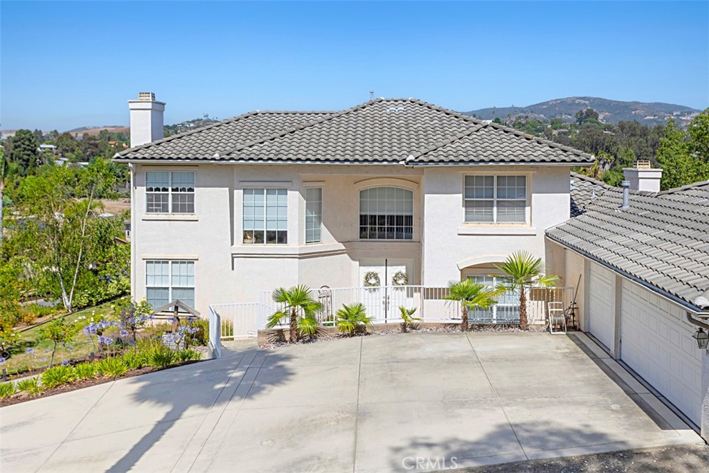1957 Cresthaven Drive Vista, CA 92084 - Photo 29 of 47 a front view of a house with a garden