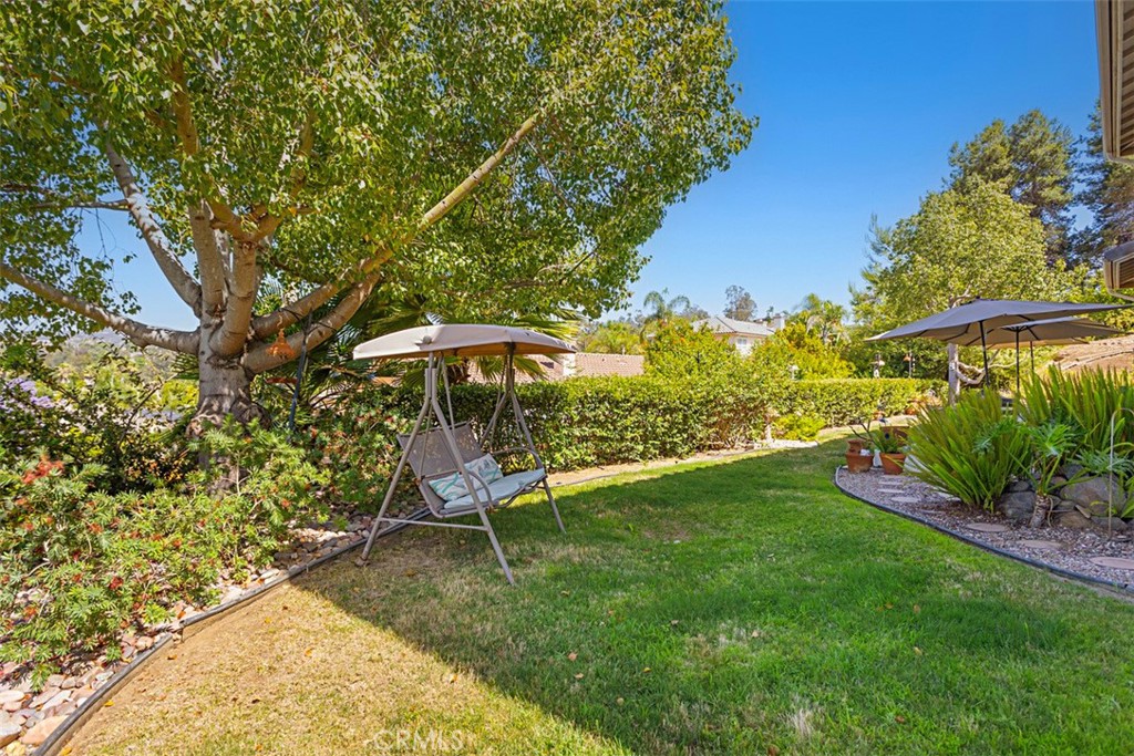 1957 Cresthaven Drive Vista, CA 92084 - Photo 40 of 47 a backyard of a house with table and chairs
