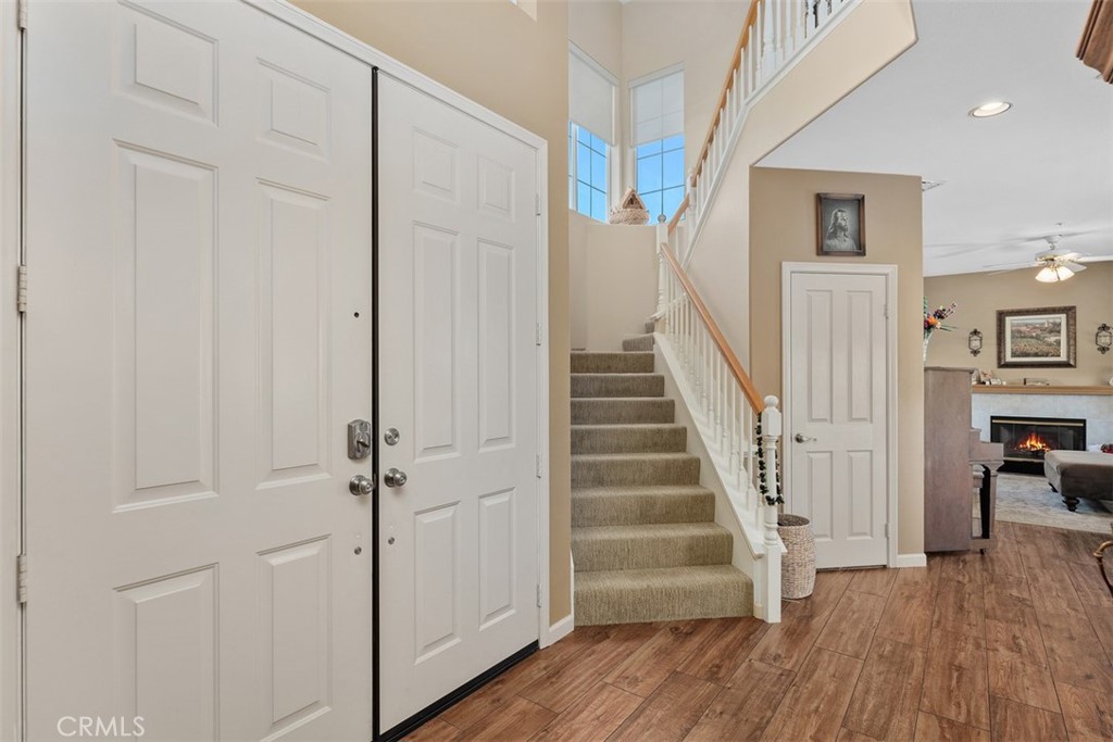 1957 Cresthaven Drive Vista, CA 92084 - Photo 4 of 47 a view of a hallway with wooden floor and entryway