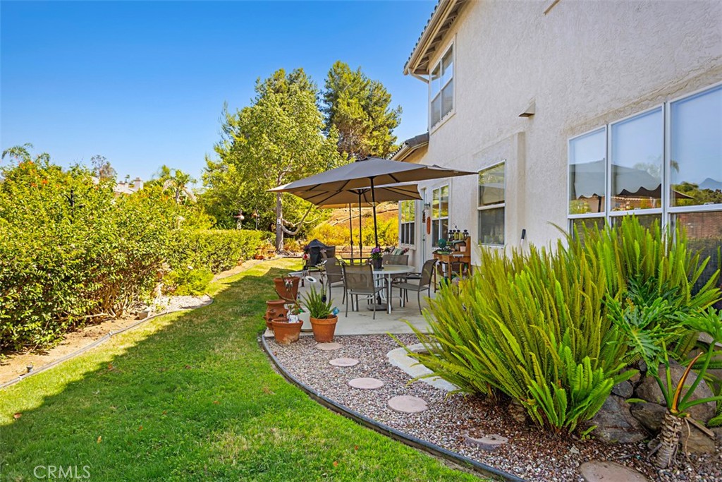 1957 Cresthaven Drive Vista, CA 92084 - Photo 42 of 47 a view of a backyard with plants and a patio