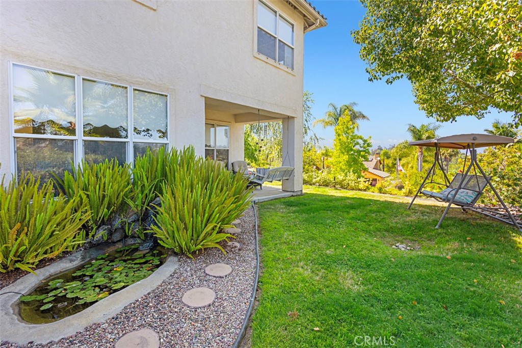 1957 Cresthaven Drive Vista, CA 92084 - Photo 43 of 47 a view of a backyard with plants and a garden