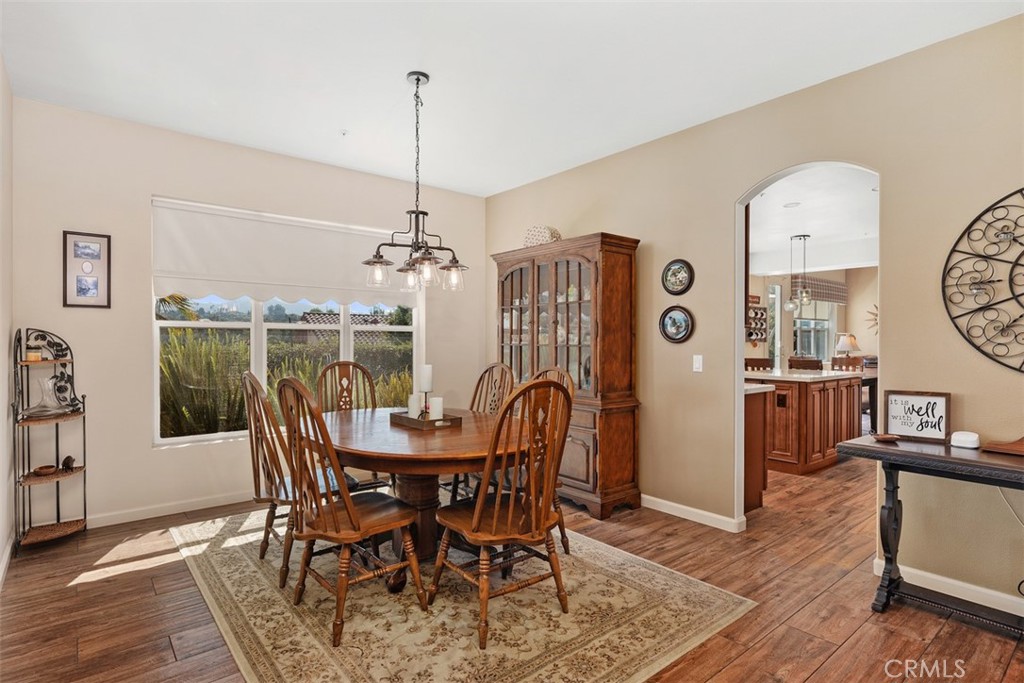 1957 Cresthaven Drive Vista, CA 92084 - Photo 8 of 47 a view of a dining room with furniture window and wooden floor