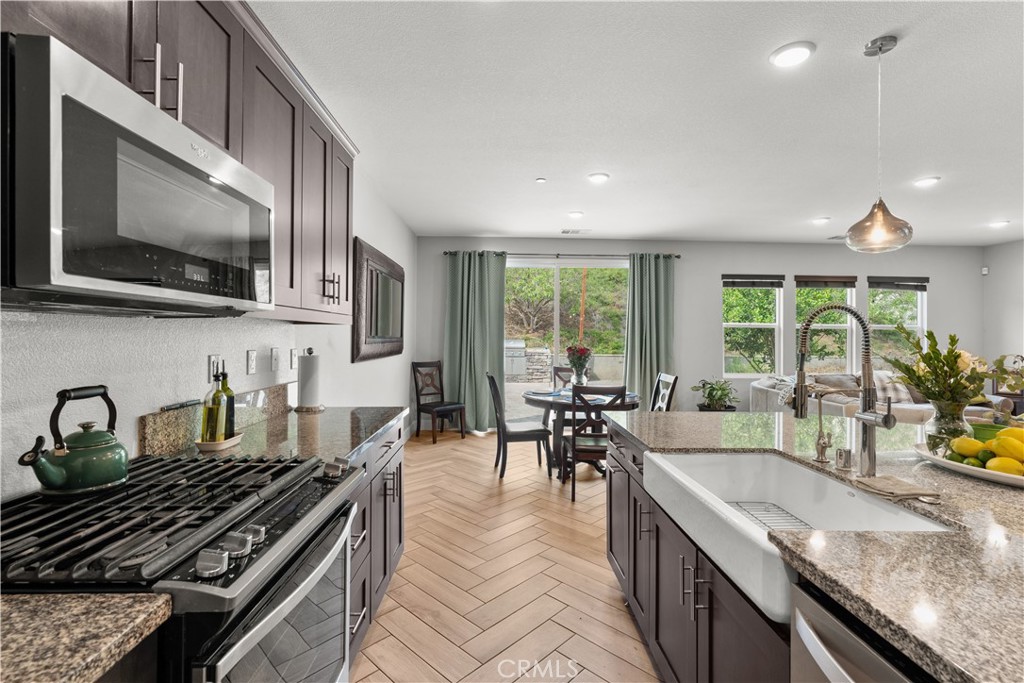20948 Center Street Riverside, CA 92507 - Photo 43 of 92 a kitchen with sink stove and cabinets