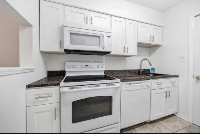 3142 Reeves Street Smyrna, GA 30080 - Photo 7 of 13 a kitchen with white cabinets and white appliances