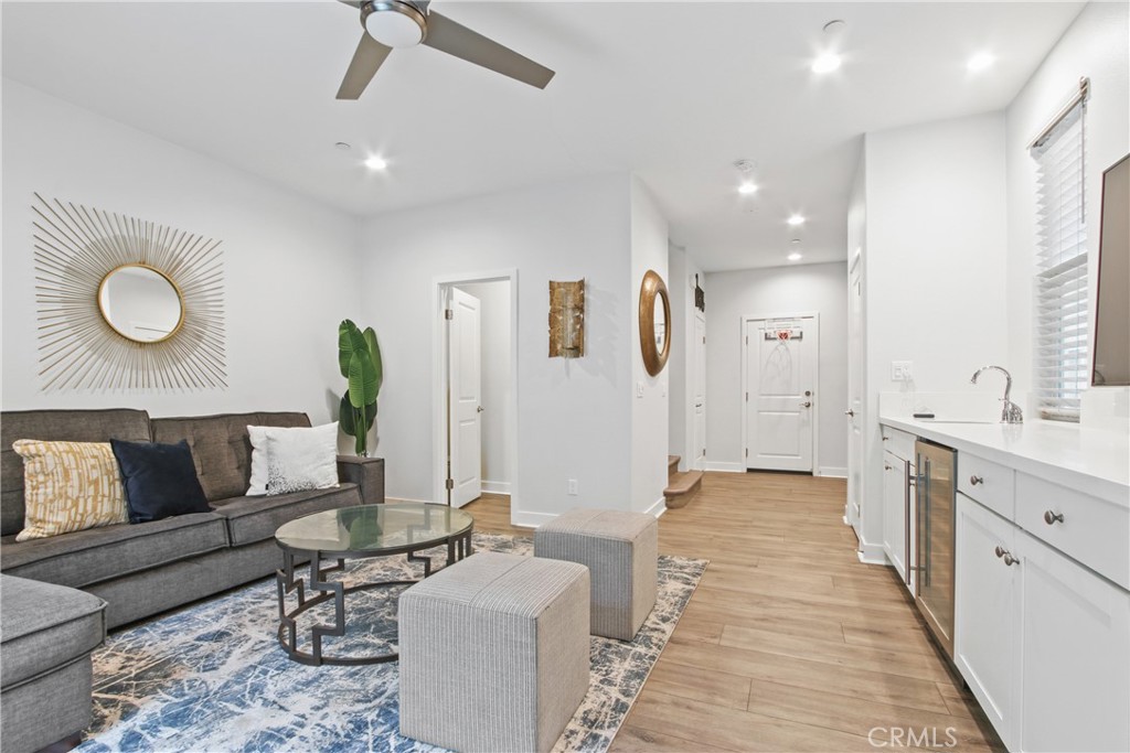 a living room with furniture and a rug