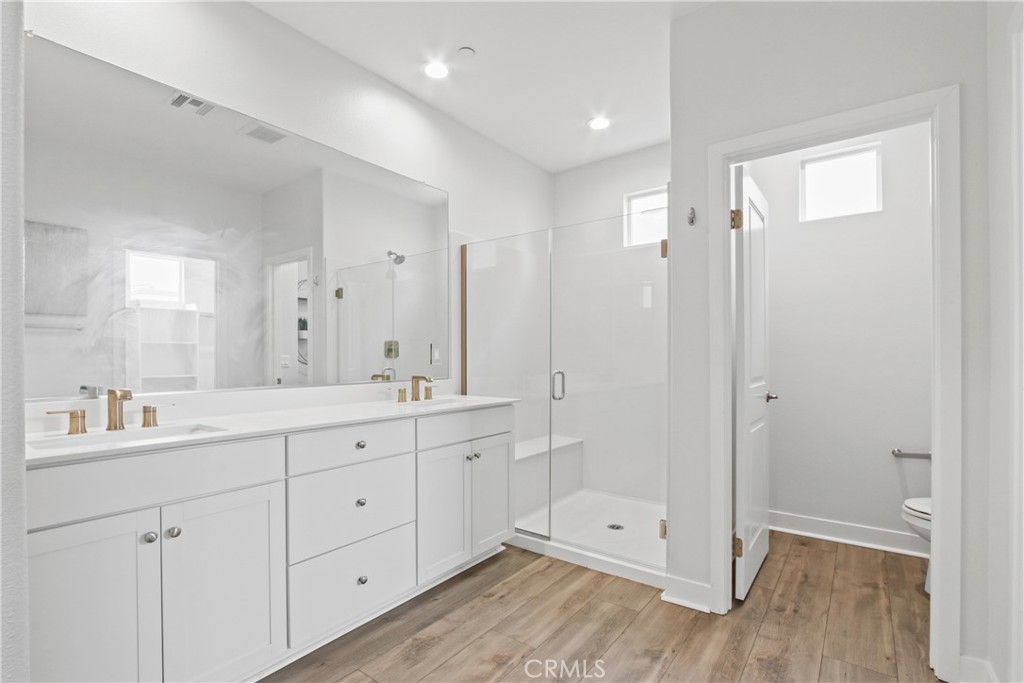 660 Daniel Freeman Circle Inglewood, CA 90301 - Photo 11 of 25 a spacious bathroom with a double vanity sink a mirror and a shower