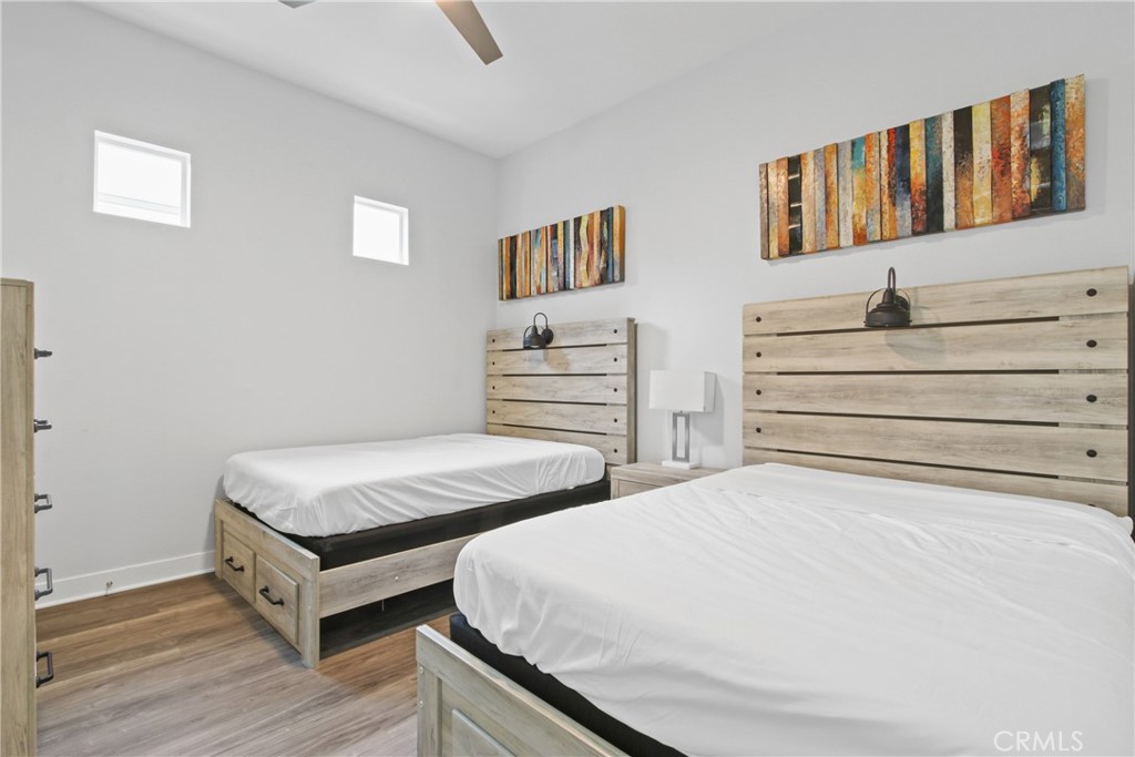 660 Daniel Freeman Circle Inglewood, CA 90301 - Photo 17 of 25 a bedroom with two beds and painting on the wall