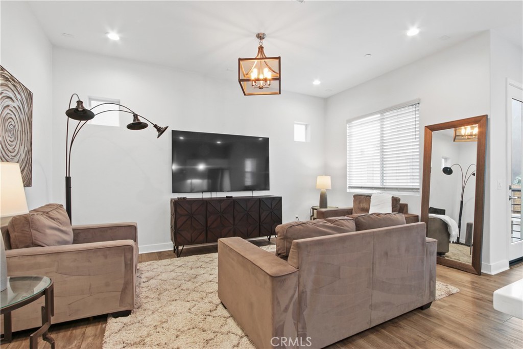 660 Daniel Freeman Circle Inglewood, CA 90301 - Photo 7 of 25 a living room with furniture and a flat screen tv