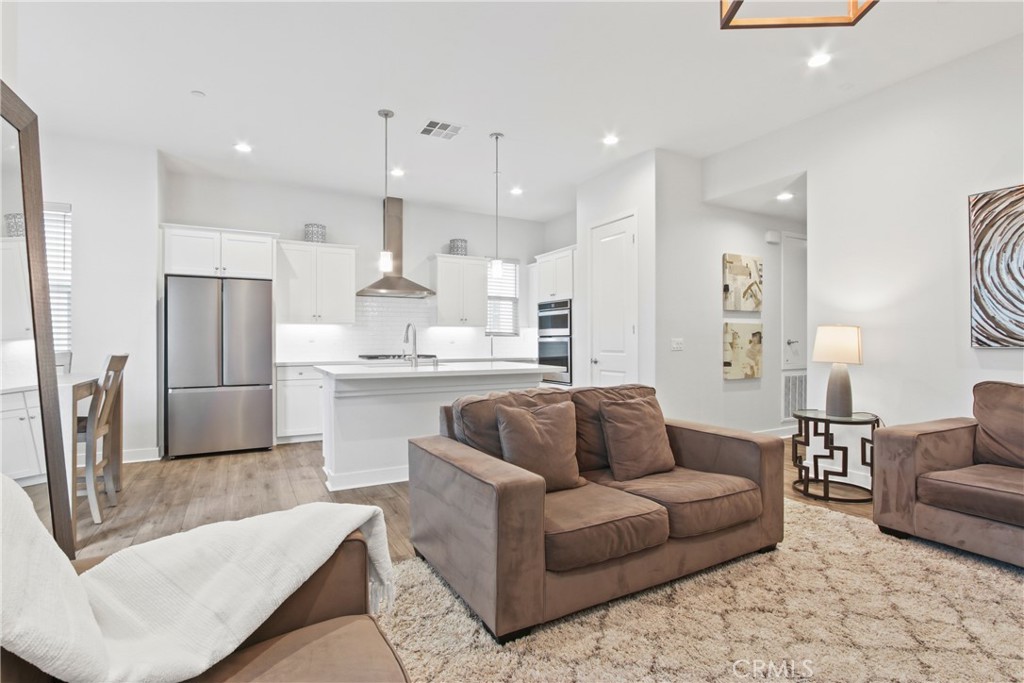 660 Daniel Freeman Circle Inglewood, CA 90301 - Photo 8 of 25 a living room with furniture and kitchen view