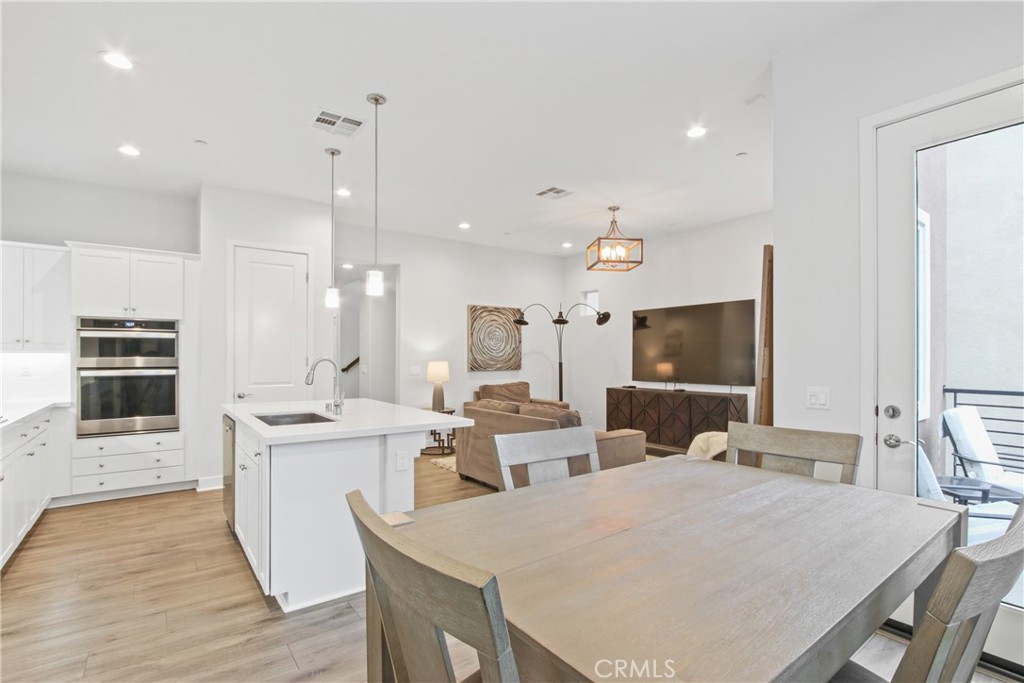 660 Daniel Freeman Circle Inglewood, CA 90301 - Photo 9 of 25 a large kitchen with kitchen island a sink a counter space and stainless steel appliances