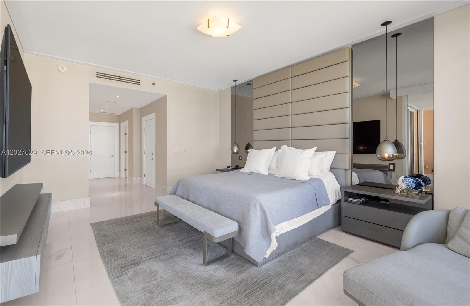 799 Crandon Boulevard, Unit PH8 Key Biscayne, FL 33149 - Photo 11 of 47 a spacious bedroom with a bed and furniture