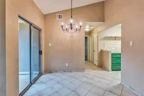 a view of a chandelier in big room and chandelier