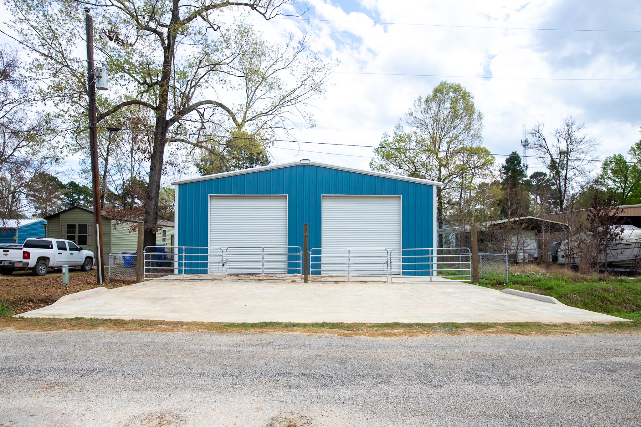 381 Antigua Drive Point Blank, TX 77364 - Photo 14 of 14 a view of house with outdoor space and trees