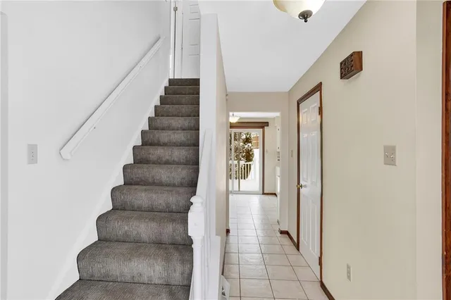 a view of an entryway with wooden floor