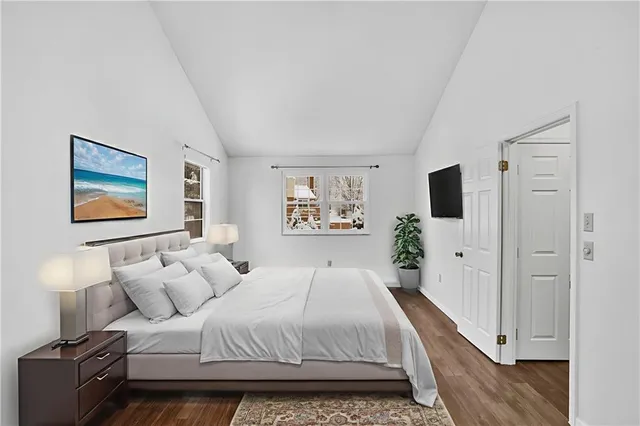 a large white bed in a white room