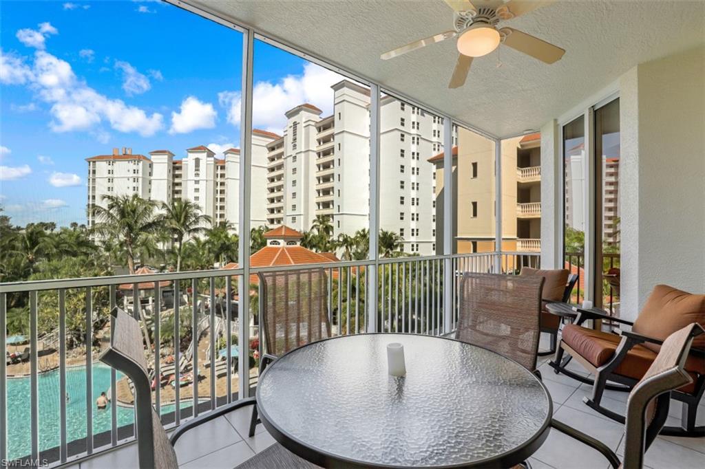460 Launch Circle, Unit 403 Naples, FL 34108 - Photo 18 of 34 a view of a balcony with furniture