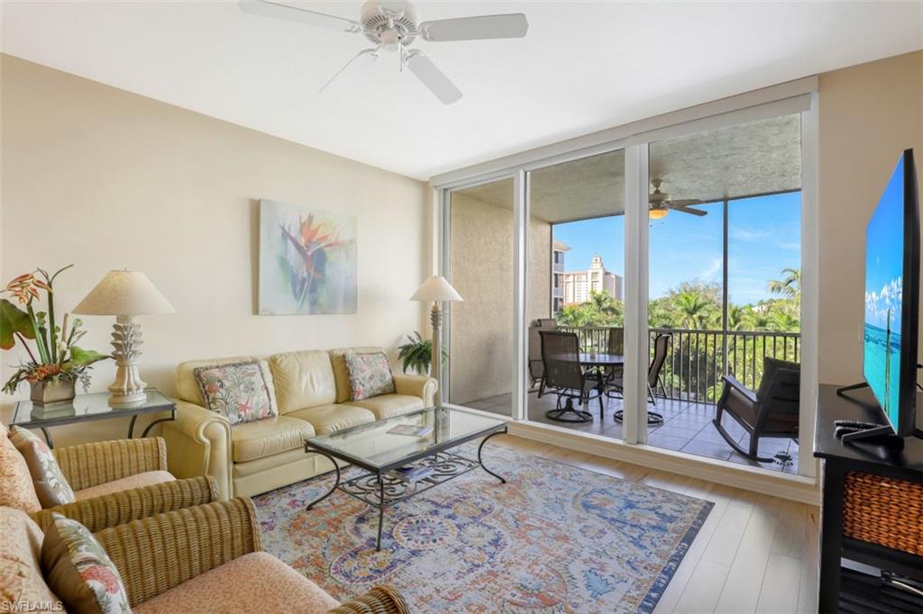 460 Launch Circle, Unit 403 Naples, FL 34108 - Photo 4 of 34 a living room with furniture and a rug