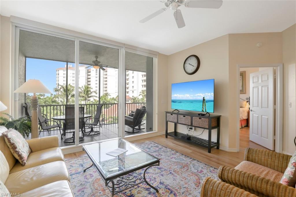 460 Launch Circle, Unit 403 Naples, FL 34108 - Photo 5 of 34 a living room with furniture and a window