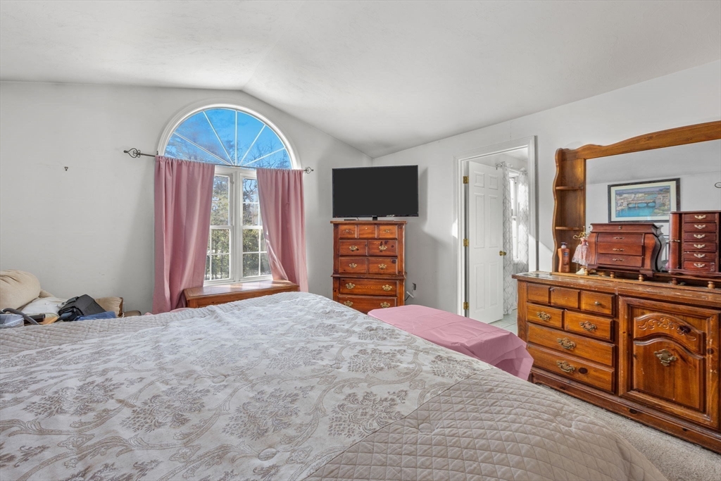 4 Mather Drive Wareham, MA 02571 - Photo 11 of 31 a bedroom with a bed and a dresser with mirror