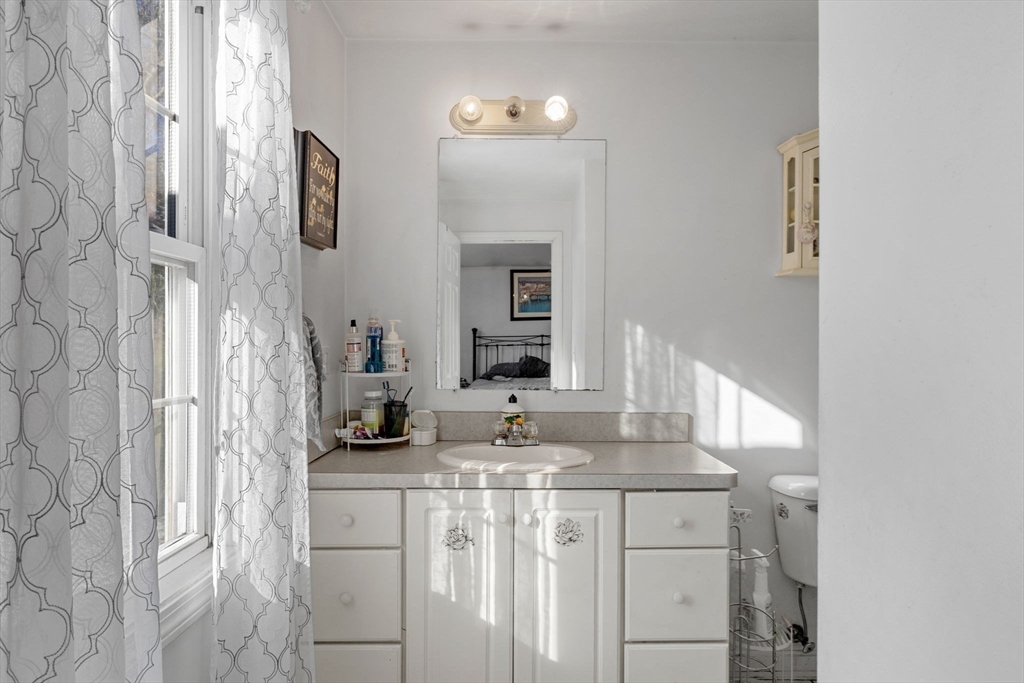 4 Mather Drive Wareham, MA 02571 - Photo 12 of 31 a bathroom with a granite countertop sink and a mirror
