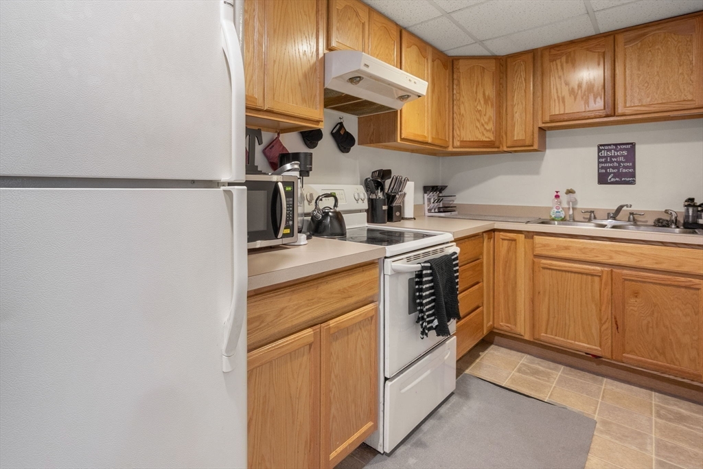 4 Mather Drive Wareham, MA 02571 - Photo 14 of 31 a kitchen with a sink dishwasher stove and cabinets