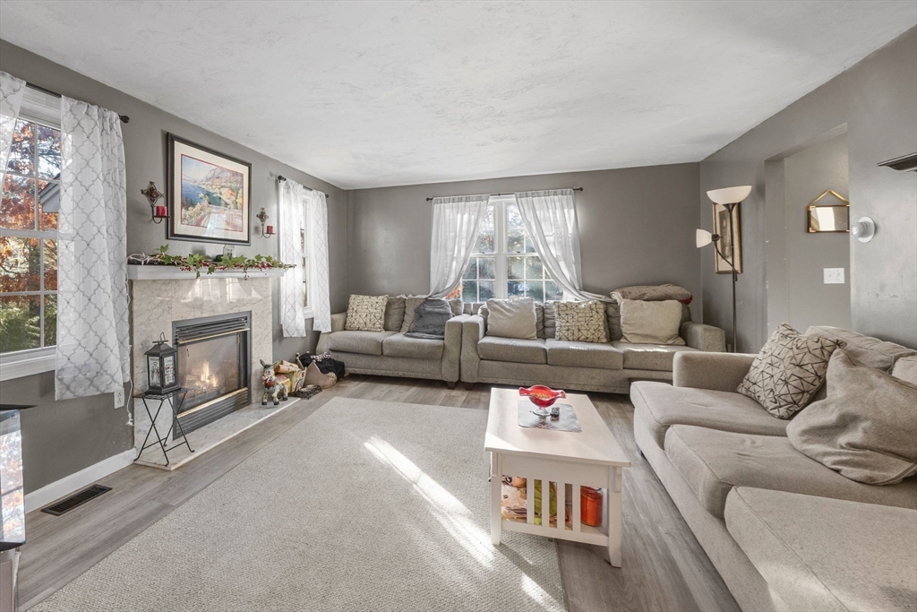 4 Mather Drive Wareham, MA 02571 - Photo 7 of 31 a living room with furniture and a fireplace